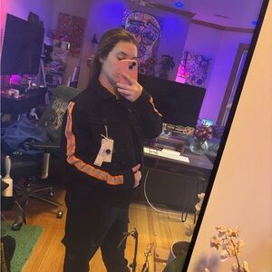 Black Jacket with Orange Accents